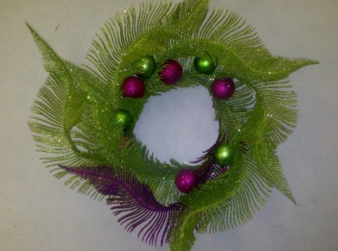 purple and green christmas wreath with ornaments
