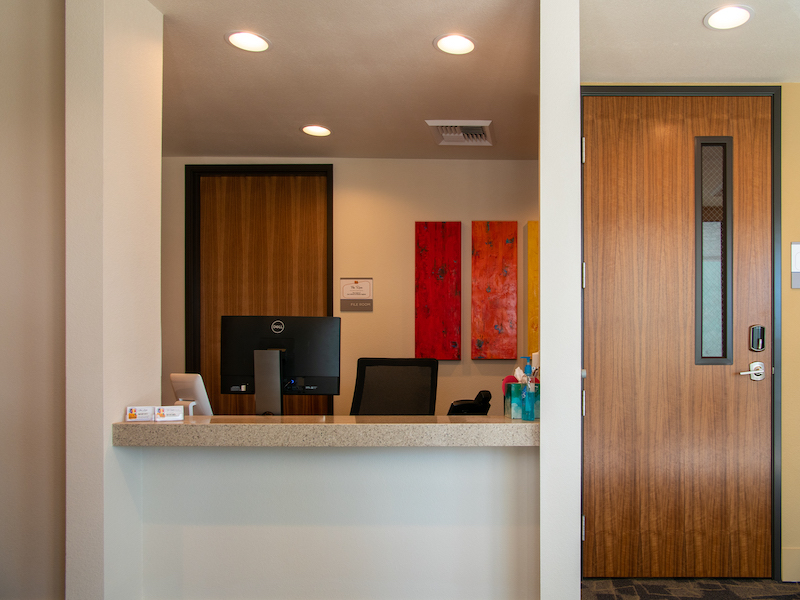 Office front desk with entrance door
